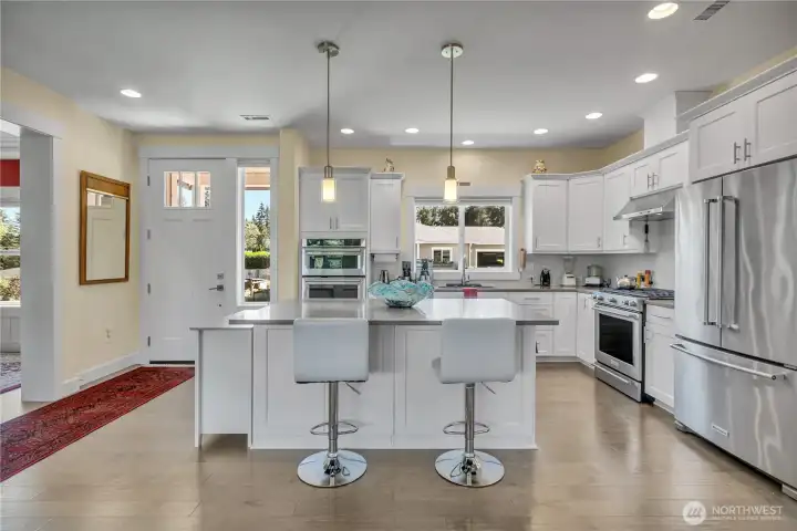 Kitchen is accented with gorgeous hardwoods, wonderful natural lighting and luxury appeal