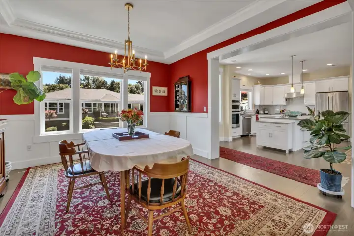 Oversized formal dining room seats 8-10 and adjoins to the gourmet kitchen