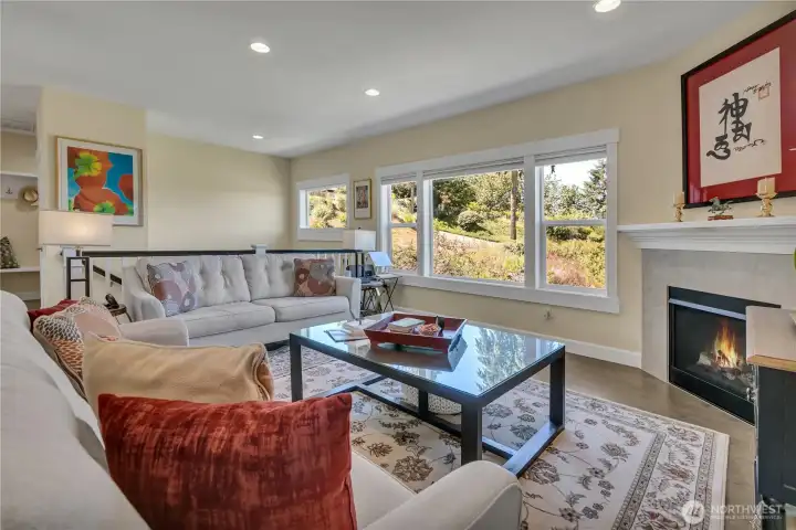 Great room has a marvelous ambiance and features a gas fireplace and bay window overlooking territorial views