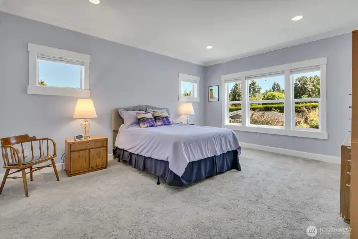 Main Floor primary EnSuite is oversized and features wonderful window appeal with natural light streaming in
