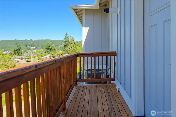 Deck just off garage accessing sitting patio