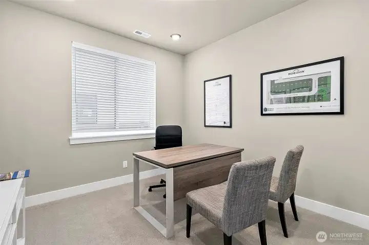 Main floor bedroom/office/den with a closet