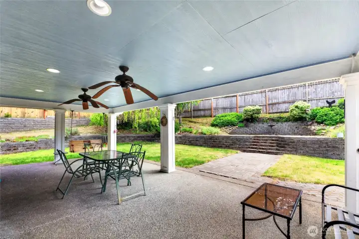 This main covered porch is an amazing space for outdoor gethering year round!