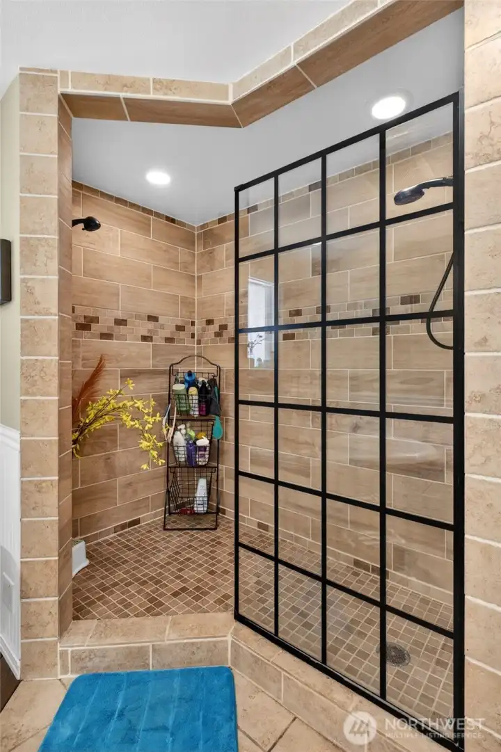 The primary bathroom shower is impressive
