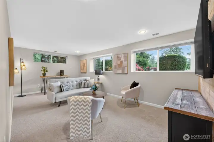 Downstairs, enjoy a rec room with brand new carpet.  Great for entertaining or multgenerational living