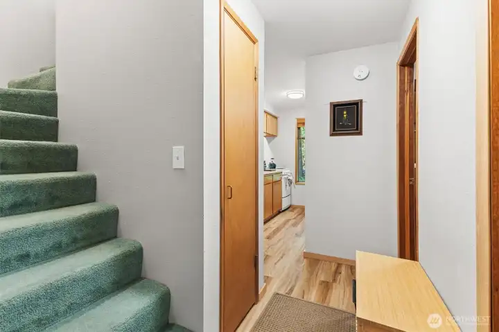 Entry foyer with staircase leading to the upper-level loft and sleeping areas.