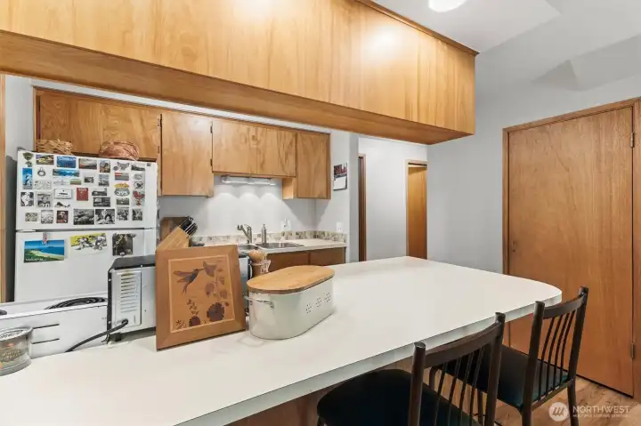 Dining area conveniently positioned adjacent to the kitchen for gatherings and everyday meals.