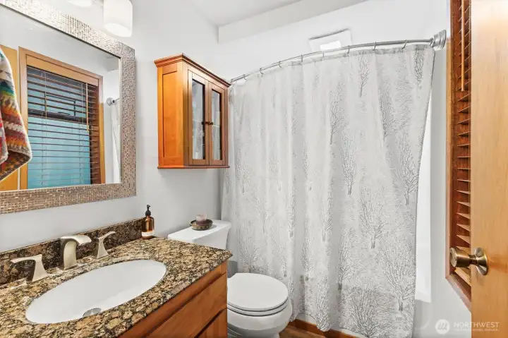 Updated bathroom featuring refreshed finishes and functional design.