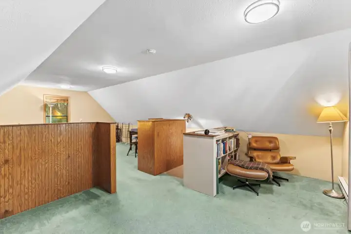Flexible upper-level layout offers potential for multiple sleeping configurations.