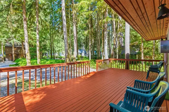 Covered deck area provides year-round enjoyment surrounded by nature.