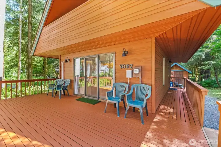 Covered entry deck offers a welcoming arrival and additional outdoor seating area.