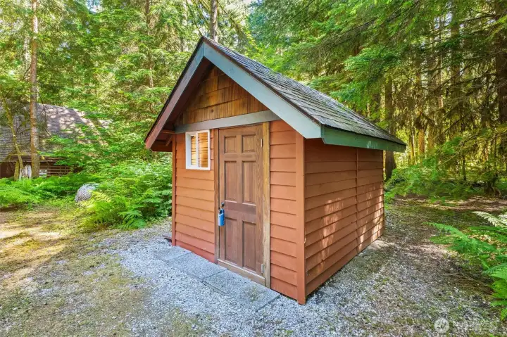 Detached outbuilding offers valuable storage and utility space.