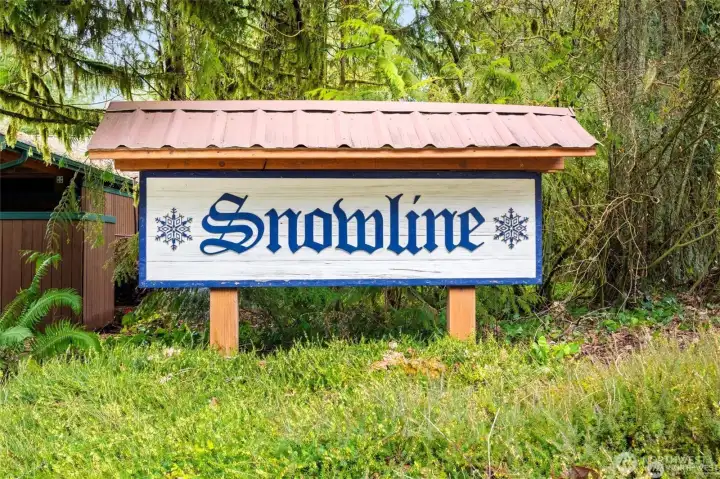 Entrance sign to the desirable gated Snowline Community.