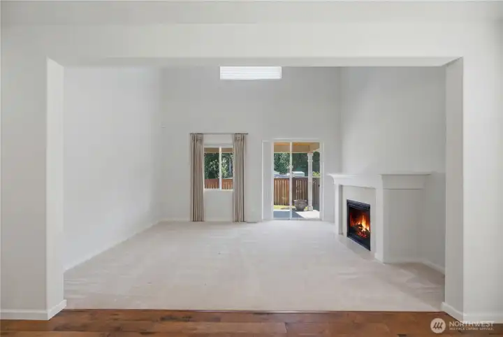 Large living room with access to private backyard.