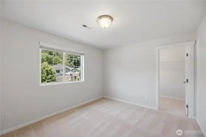 Bedroom 2 upstairs with walk in closet