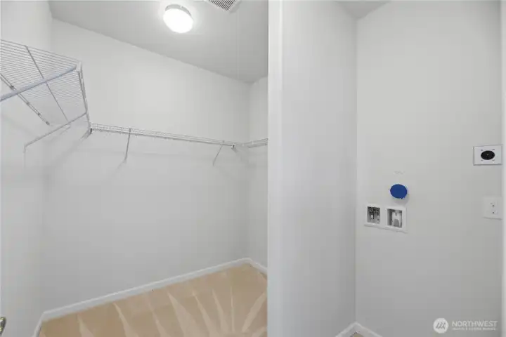 Main floor walk in closet with washer/dryer hookup