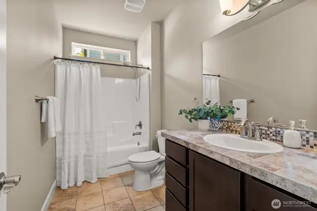 Full bath is between the 2 downstairs bedrooms.