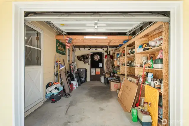 Enclosed 1 car garage with shelving
