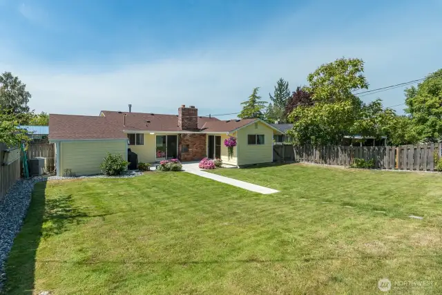 Backyard is fully fenced with alley access