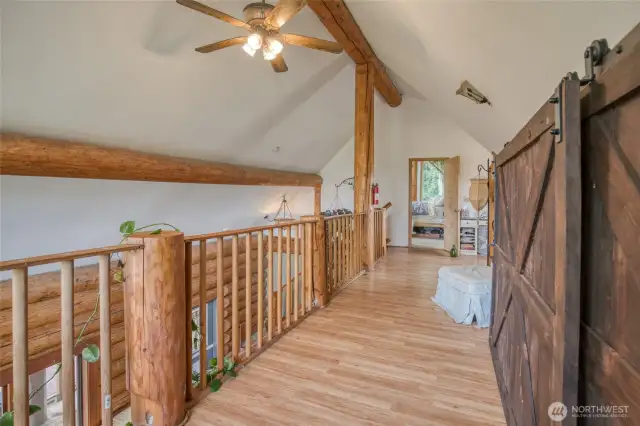 Loft area outside of bedroom w/ storage space