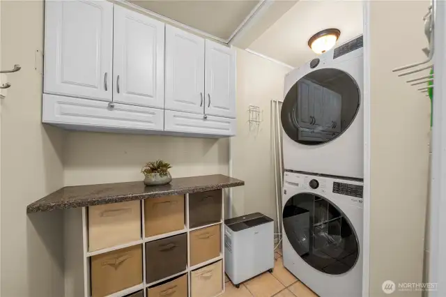 Convenient laundry space with washer and dryer included.