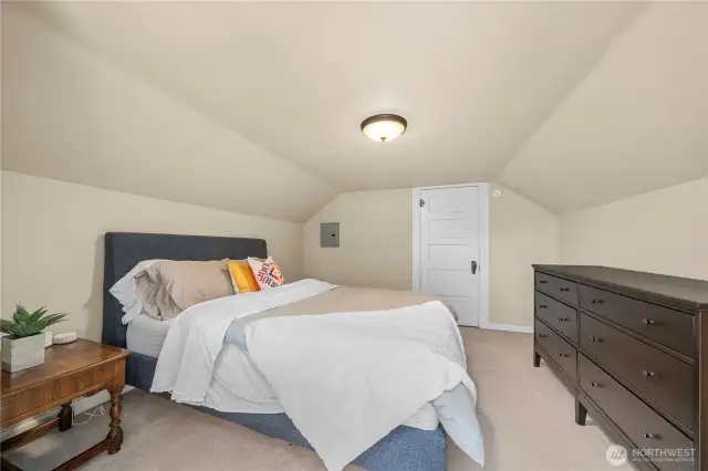 Upstairs bedroom offers extra privacy and is next to a spacious, spa-like bath.