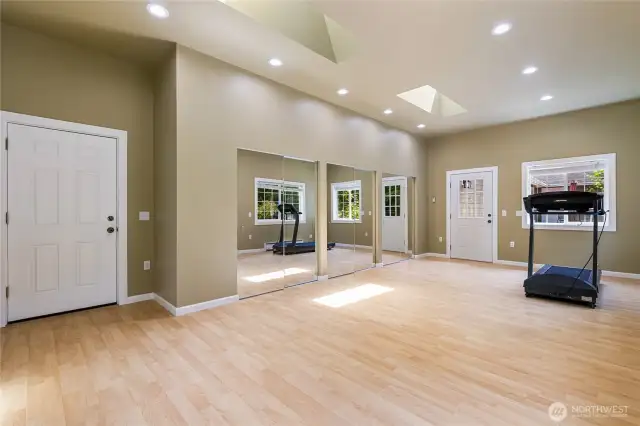 Bonus room attached to the garage. Possible mother-in-law suite or ADU with its own entry door. Not in the photo is the other wall with multiple closet space.