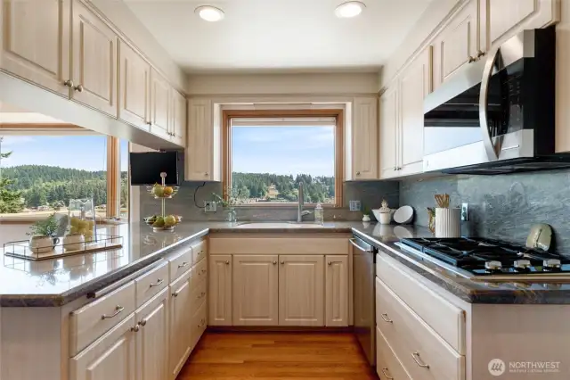 Granite counter tops and a gas cooktop compliment this kitchen in the best ways.