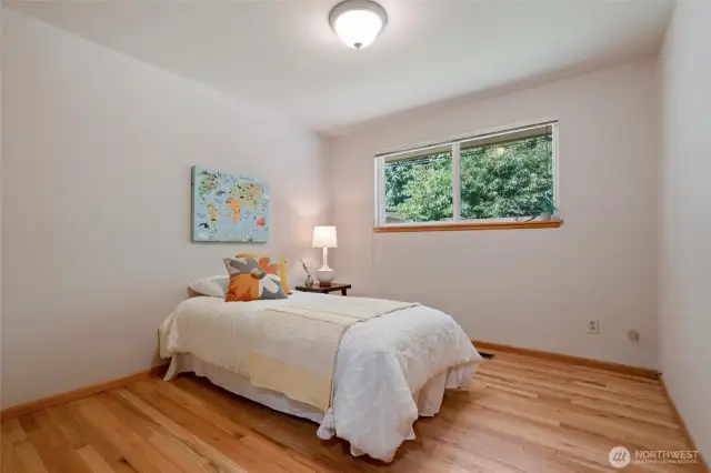 Hardwood flooring continues into each of the home's 3 bedrooms.