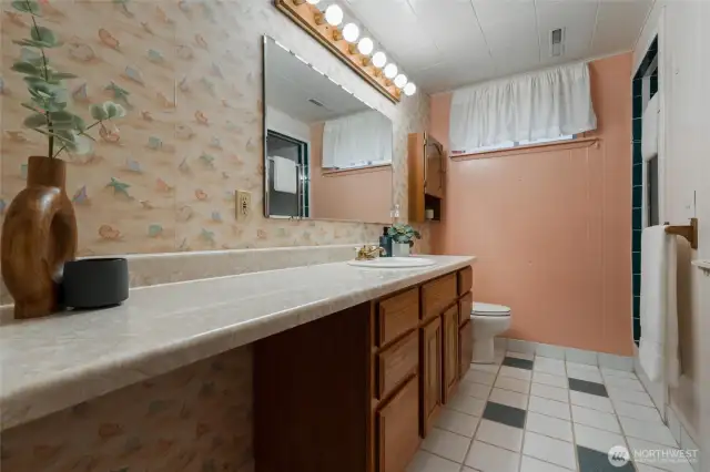 The lower level 3/4 bathroom includes a tile floor and shower.