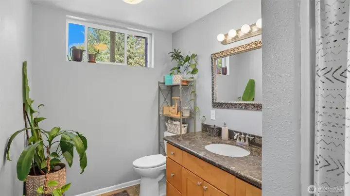 Perfect guest retreat with practical finishes and fresh light.