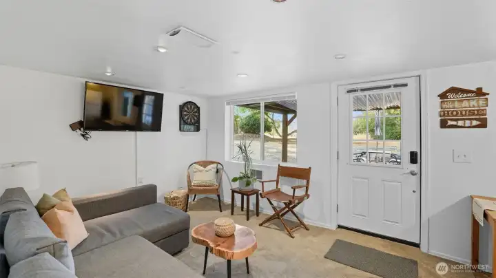 Comfortable living space that doubles as a game room or media area.