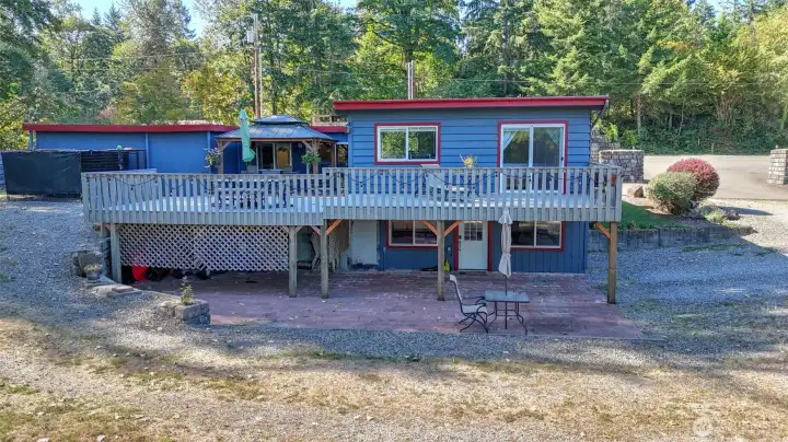 Nestled against a natural backdrop, this home offers privacy and tranquility.