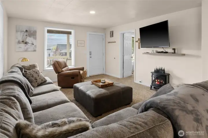 Another view of living room. You will see the front door entrance as well.