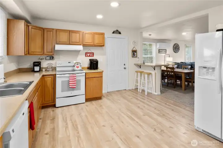 Another view of the kitchen leading into the dining room and living room.