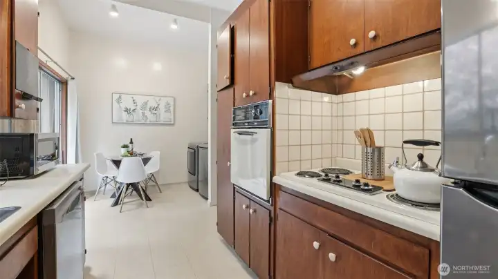 Enjoy a perfect morning flow—from kitchen prep to coffee in the breakfast nook.