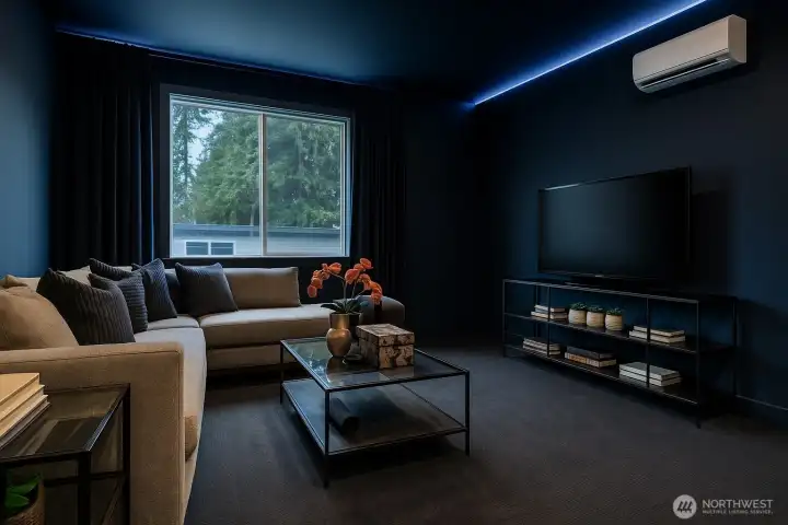 Virtual Staging: Imagine this room as a dramatic navy home theater with blackout drapes and LED lighting for movie nights and gaming