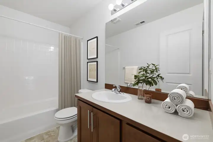 Upstairs bathroom (virtually staged)