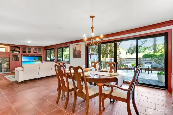 Large dining area looks out over the backyard.