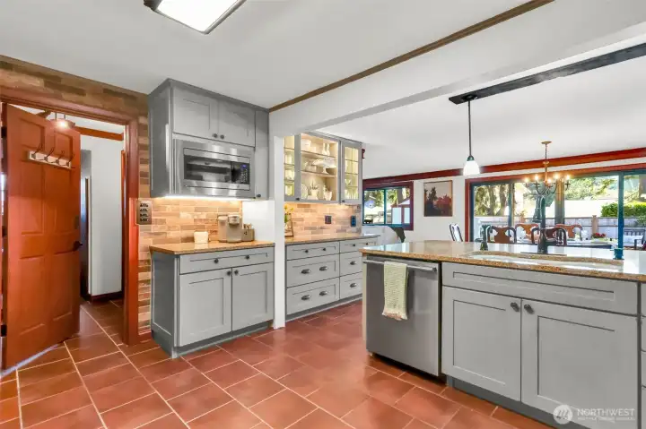 The laundry room and ample pantry storage is just off the kitchen.