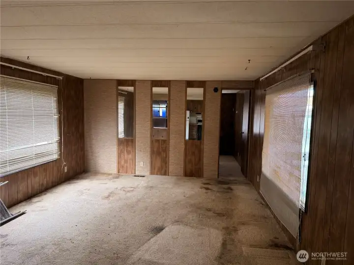 Large family room off kitchen waiting for you new ideas to make it shine again.  2 large windows bring in lots of light in morning and afternoon
