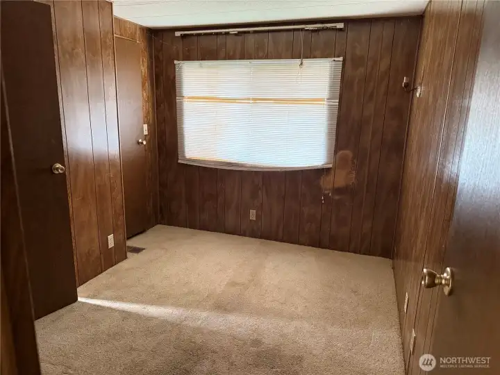 another view of second pirmary bedroom at opposite end of home with own bathroom