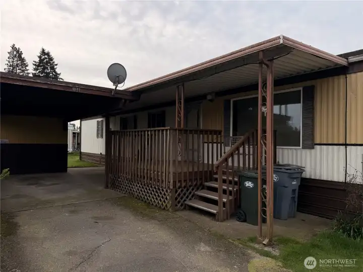 View of large driveway covered entry way waiting for new facelift