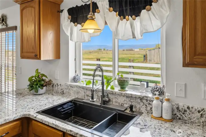 Enjoy doing the dishes with the northern field and mountain views!