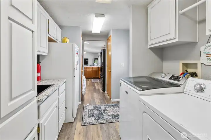 Laundry room with new counter and sink plus SO much storage space!