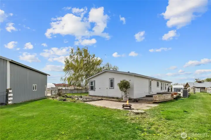 Nice backyard area with patio by the water feature with waterfall!