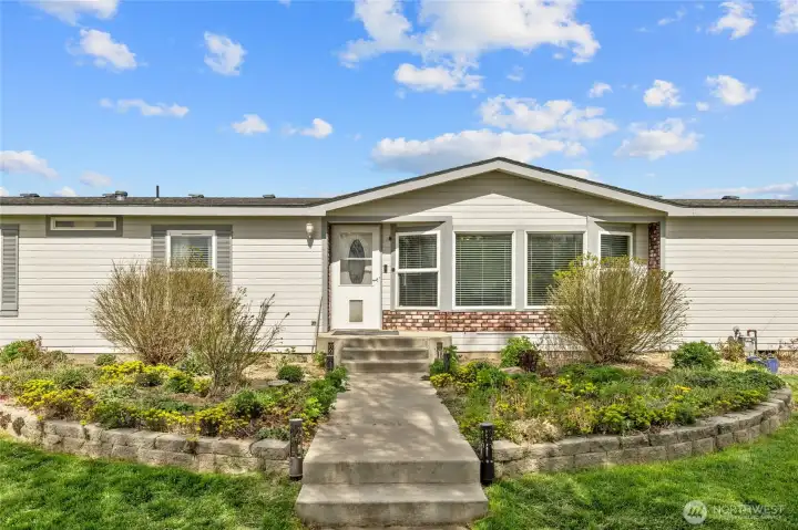 Perenials and landscaping welcome you into your new home!