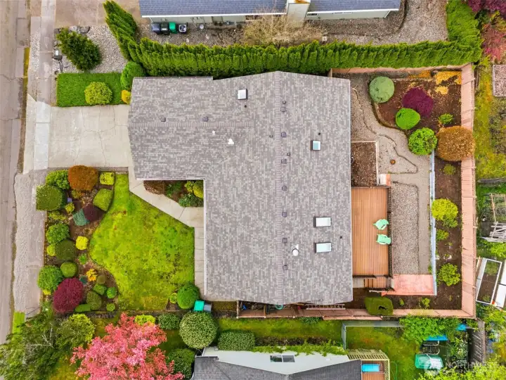 Aerial view of the roof line and lots.  Brand new roof, composite rear deck and low maintenance landscaping complete the package.