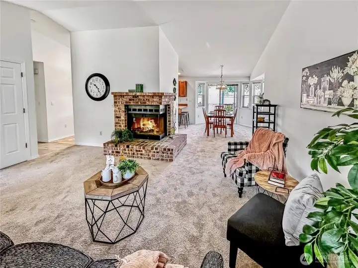 In this photo you see the formal dining area with access to the rear yard and hall that leads to the bedrooms.