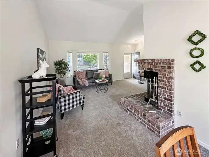 In this photo you are looking back toward the living room, front entry and one side of the corner fireplace.